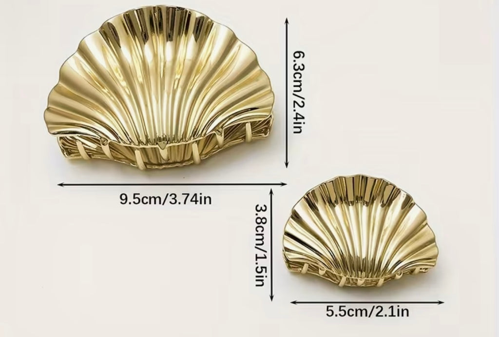 $9.990 Set de 2 Pinzas de pelo con diseño de concha marina – Elegancia atemporal y veraniega